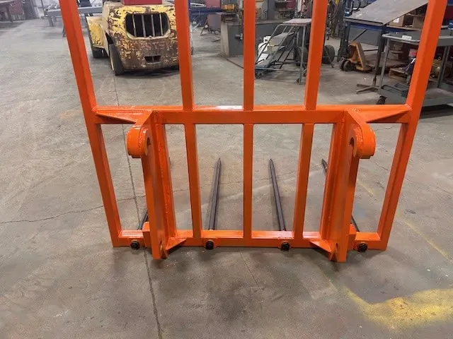 Custom bale handler built to move large hay bales